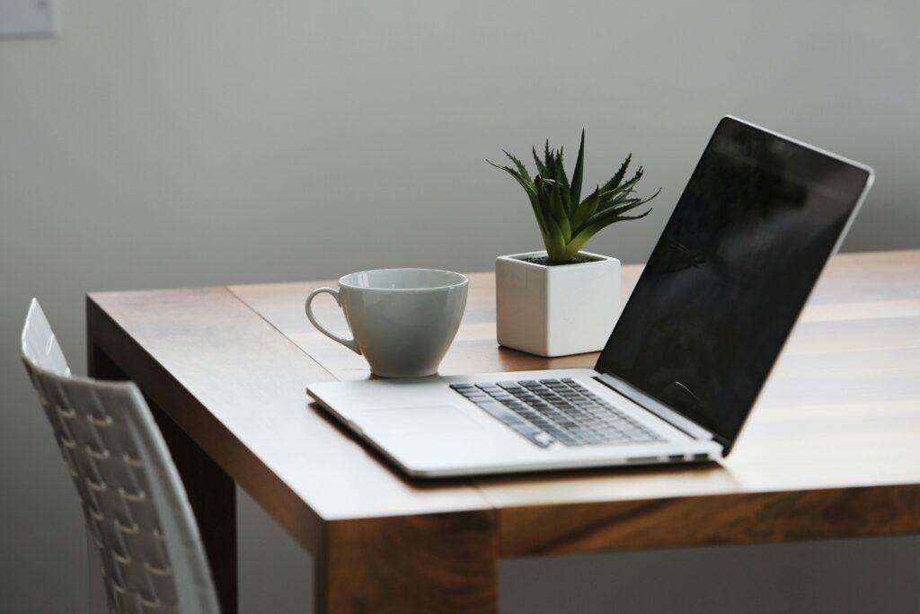 psychotherapist guelph open laptop on wooden table with a teacup